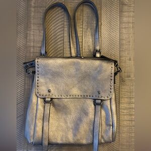 Jen & Co Valerie Flap Metallic Silver Backpack with Grommet Detailing